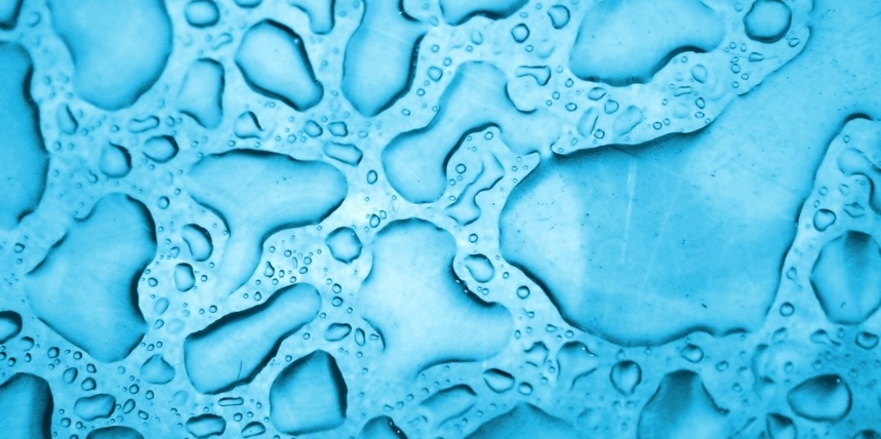 Water drops background in cyan